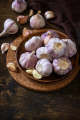 Garlic. Garlic Cloves and Bulb on rustic wooden table. Copy space.