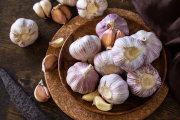 Garlic. Garlic Cloves and Bulb on rustic wooden table.