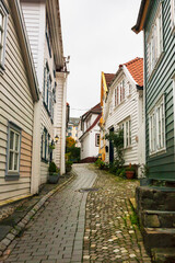 A pretty little lane of traditional weatherboarded wooden cottages: St. Hansstredet, Nøstet, Bergen, Norway