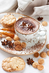 Fototapeta na wymiar Aromatic cocoa drink with almond cookies