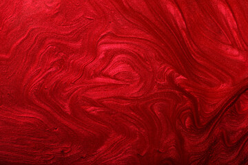 Horizontal red shimmer abstract background. Make up concept.Beautiful stains of liquid nail laquers.Fluid art,pour painting technique.Horizontal banner,can be used as backdrop for chat.