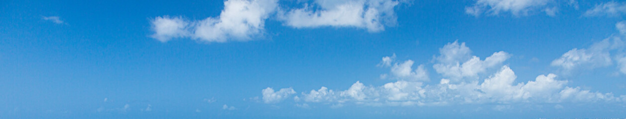 Image of a partly cloudy and partly clear sky during the day