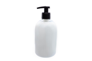 Transparent soap dispenser full of white soap