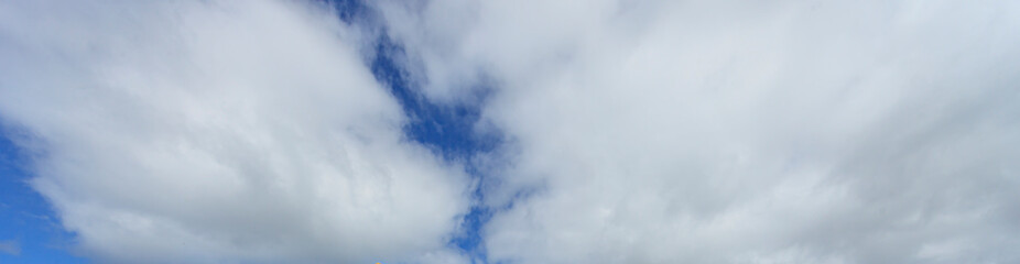 Image of a partly cloudy and partly clear sky during the day