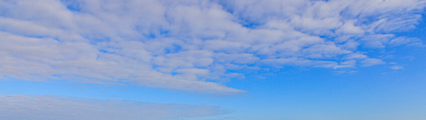 Image of a partly cloudy and partly clear sky during the day
