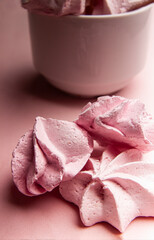 Several delicate, fresh pink meringues. Monochrome pink composition