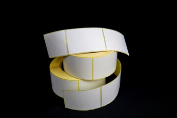 Blank Label Stickers. White roll of labels for thermal perforation. Sticky label roll.