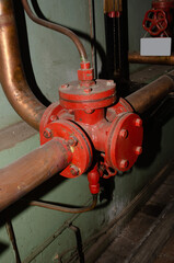 Old rusty control equipment, the old red valve can serve as a relic