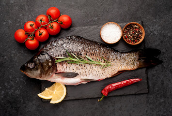 raw carp on a stone background