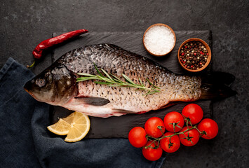 raw carp on a stone background