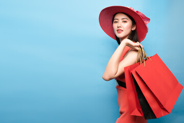 Black Friday and shopping concept.young asian woman holding many shopping bags.Happy woman holding...