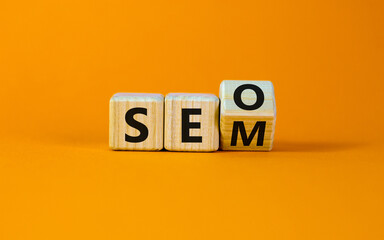 SEO versus SEM. Turned a cube and changed the expression 'SEO' to 'SEM' or vice versa. Concept for...