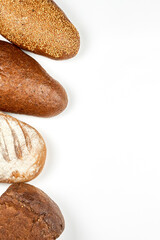 Freshly baked loaves of bread. Bakery products on white background with copy space