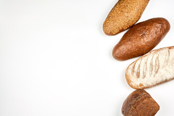 Freshly baked loaves of bread. Bakery products on white background with copy space