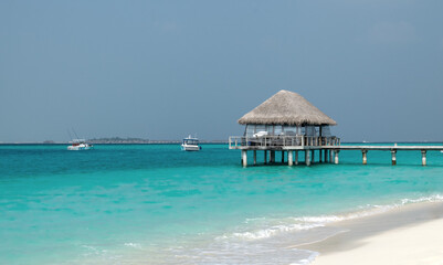 Jetty pier over water at beautiful sandy beach. Perfect Holidays destination