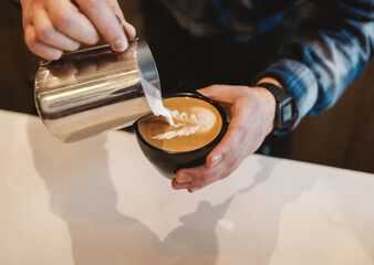 Barista pouring latte art