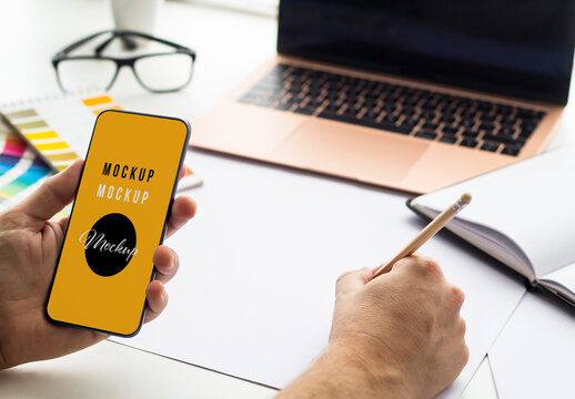 Designer Holding a Mobile Mockup