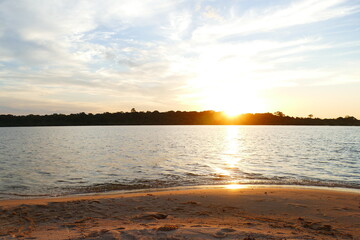 Tropical Amazon landscape at sunset, paradise with the sandy river beach and the crystal clear waters of the Rio Tapajós, near the village of Solimões, State of Pará, Brazil