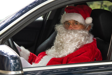 santa claus driving the car at christmas