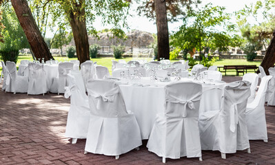 Laid wedding table outdoors at the park.