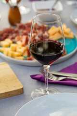 Set up table with red. wine and appetizers