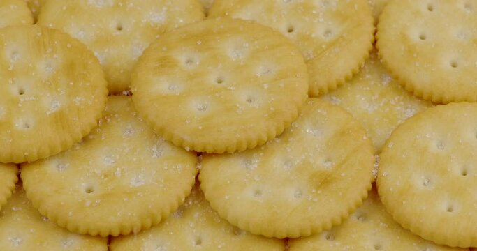 Truck shot of pile round cracker with sweet sugar falling down