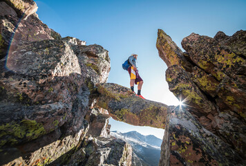 Climber on a Rock in the Mountains
