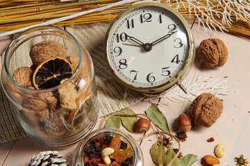 christmas decoration in rustic style and holiday background, still life on wooden backdrop, bread, nuts and other