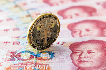 one hundred yuan banknotes, next to an e-RMB gold coin, digital version of the yuan. Concept of new digital currency of the popular republic of china - obrazy, fototapety, plakaty