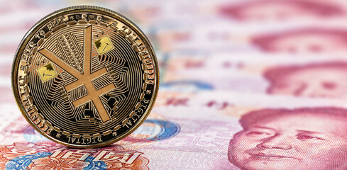 e-RMB gold coin, over 100 yuan banknotes, conceptual image of the digital version of the yuan. Chinese decentralized currency