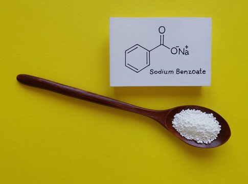 Structural chemical formula of sodium benzoate molecule with white sodium benzoate preservative. Sodium benzoate is a widely used preservative in many foods, cold drinks, cosmetics. Food additive E211