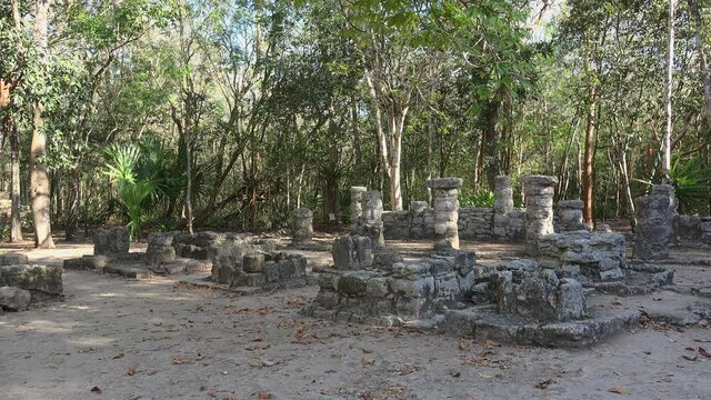 Tourist in the Conjunto Pinturas group ruins in the Coba Archeological Area. Mexico.