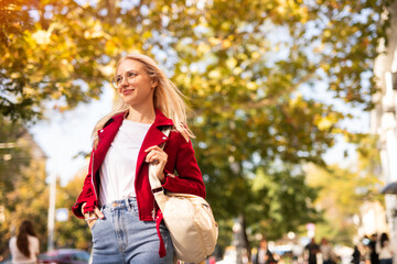 Stylish student on city street