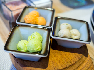 Vases with balls of butter with additives