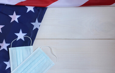 Protective surgical medical face mask on American national flag. US presidential election in the...