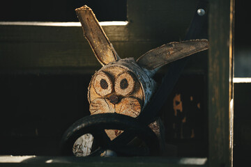 Alert and attentive driver behind the wheel of a wooden truck.