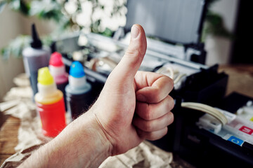 Refilling printer cartridges with multi-colored ink. Background