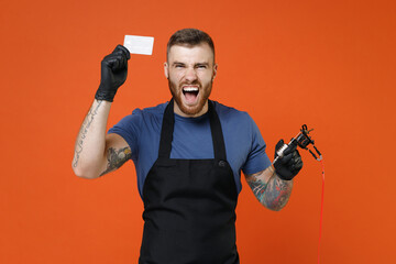 Screaming professional tattooer master artist tattooed man in apron hold credit bank card machine...