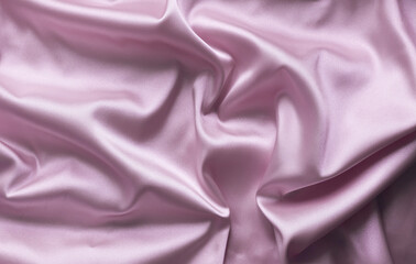 Smooth elegant pink silk with soft folds can be used as background