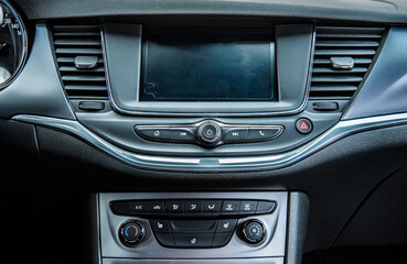 Naklejka premium Car interior. Dashboard. Radio in the car. 