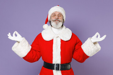 Fototapeta na wymiar Santa Claus man in Christmas hat red coat glasses hold hands in yoga gesture, relaxing meditating, trying to calm down isolated on violet background. Happy New Year celebration merry holiday concept.