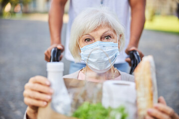 Attentive glance of aged lady in medical mask