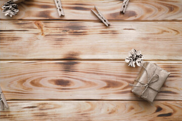 Gifts in craft paper on the wooden texture. Christmas, festive time, celebrations..