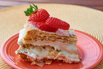 Tarta Milhojas in spanish - a pastry containing layers of puff pastry, pastry cream, strawberries, manjar and sugar. Also called mille feuilles or napoleon cake