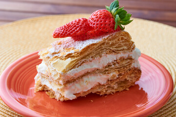Tarta Milhojas in spanish - a pastry containing layers of puff pastry, pastry cream, strawberries, manjar and sugar. Also called mille feuilles or napoleon cake