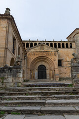 Fototapeta na wymiar Vertical view of the access stairs to the 12th century Collegiate Church, in Santillana del Mar, Spain, October 1, 2020