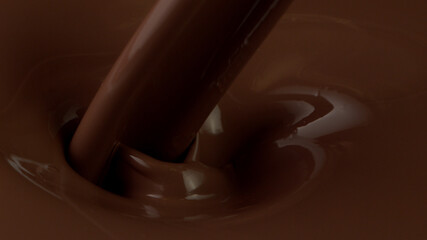 Detail of pouring hot chcocolate with splash