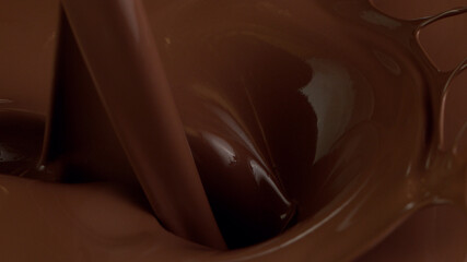 Super slow motion of pouring dark hot chocolate. Filmed with cinema high speed camera, 1000fps.