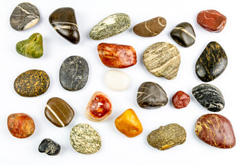 colored stones on white background with space