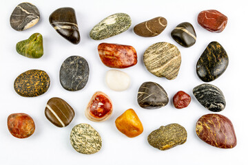 colored stones on white background with space